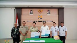Wakil Bupati Bolaang Mongondow, Dony Lumenta, menandatangani naskah perjanjian hibah BMN berupa infrastruktur jalan dari Kementerian Pekerjaan Umum di Kantor BPJN Sulawesi Utara, Kamis (29/1/2026).