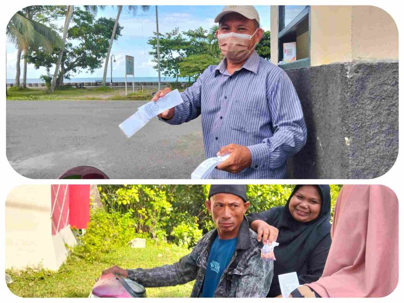 Aktivitas pembayaran retribusi di pintu masuk Pantai Batu Pinagut masih dilakukan secara manual oleh warga pengunjung, Senin (23/3/2026).