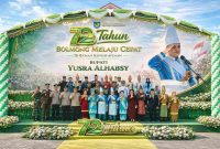 Bupati Yusra Alhabsy memimpin upacara HUT ke-72 Bolmong dengan penuh khidmat, didampingi jajaran pejabat daerah dan tokoh masyarakat, mencerminkan semangat kolaborasi dan optimisme menuju Bolmong yang maju dan sejahtera.