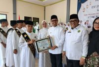 Bupati Boltara Sirajudin Lasena menghadiri Wisuda Tahfidz Juz 29 dan 30 Angkatan II MTs Negeri 2 Bolaang Mongondow Utara didampingi jajaran pemerintah daerah serta Ketua TP PKK Kabupaten Bolaang Mongondow Utara di Gedung Wanita Kawasan Wisata Pantai Batu Pinagut.